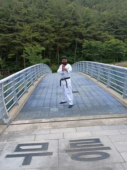 A respectful pose on the bridge at Muju.
