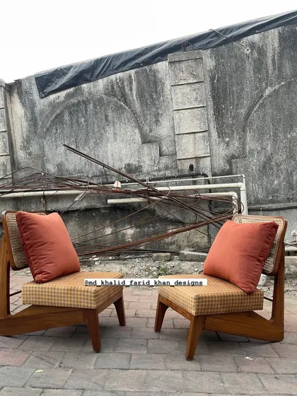 The pair of chairs with the terracotta pillows, showing how a simple addition can change the look.