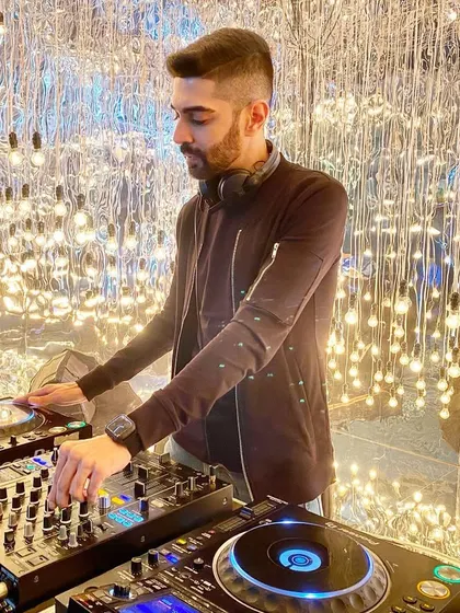 Spinning tracks in a venue with incredible lighting. The right ambiance is key, and I work with the lighting technicians to create a visual experience that matches the music.
