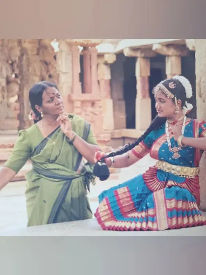 My Guru, Bhanu mam, correcting my pose during my Rangapravesha photoshoot. Her guidance chiseled me into the dancer I am today.
