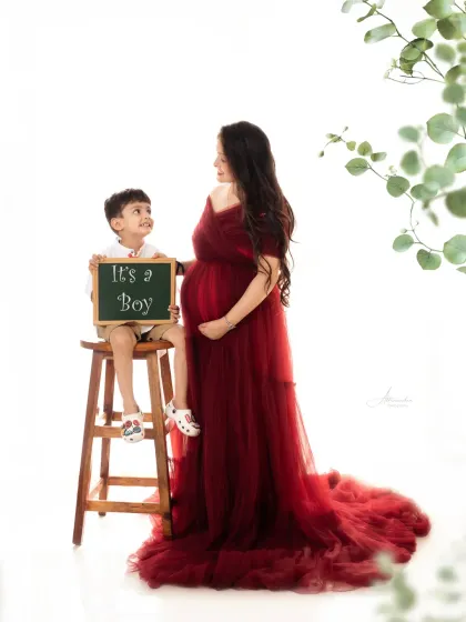 A big brother announces the arrival of his new baby sibling in this heartwarming maternity and newborn announcement shoot.