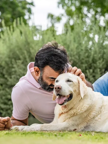 A father's gentle touch with his senior dog, Ice. This image is full of love, tenderness, and the quiet understanding that exists between a man and his best friend.