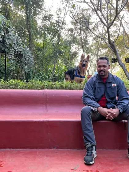 A relaxed weekend at a farm stay in Kamshet. Here I am enjoying the peaceful surroundings while our dog Jiraiya explores the green space behind me.