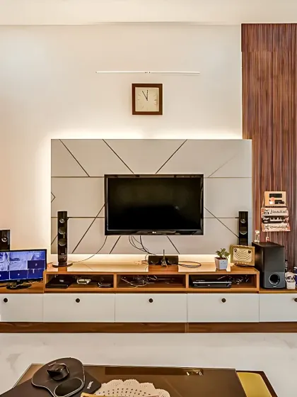 This entertainment center is designed to be the focal point of the living room, with a mix of open and closed storage and integrated backlighting.