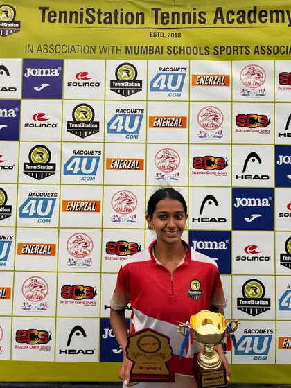 Nikita Golhar with her trophies after winning the Women's Singles at the All Star Tennis League and the Open Doubles at the Level Up Tennis Tournament.