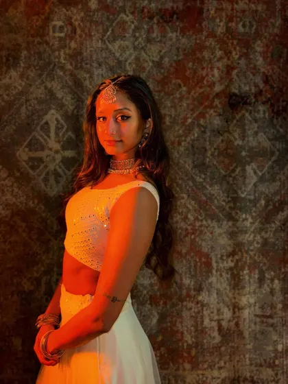 A portrait from the set of the 'Dola Re (Party)' music video. On-screen work involves both dancing and embodying a specific look and feel for the camera.