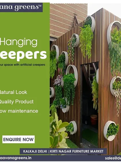Elevate your space with artificial hanging creepers. This image shows a creative installation where creepers are hung from circular holders on a WPC wall. It’s a modern and stylish way to add vertical greenery and a natural, cascading effect.