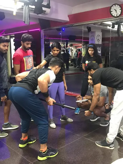 In our small group practicals, students get hands-on experience. They learn to analyze form, provide cues, and understand the mechanics of exercises like the bent-over row.