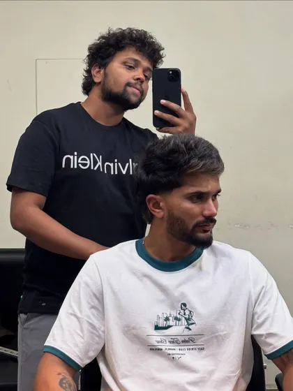 A side view of Nitish Kumar Reddy's textured mullet, a popular and modern choice.