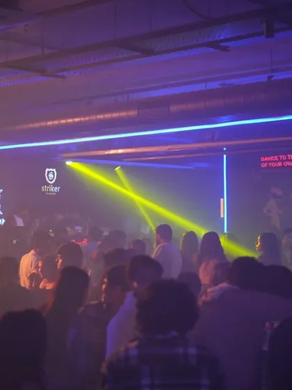 The dance floor is packed at Striker, Indore. The combination of yellow and blue lights created an electric atmosphere for a night of non-stop dancing.