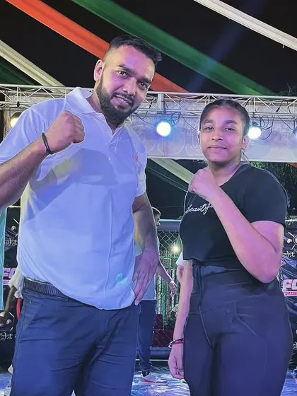 Never give up. A young female fighter posing with me after her bout.