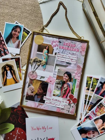 A closer look at the vintage brass frame from the birthday hamper. The collage is a mix of photos, dried flowers, and handwritten notes, creating a beautiful, personal piece of art.