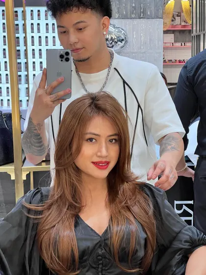 A beautiful haircut and color. The warm brown shade and layered cut create a look that is both classic and stylish.