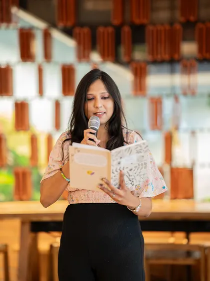 A smiling poet shares her story of vulnerability. The event was a powerful reminder of the strength in being open.