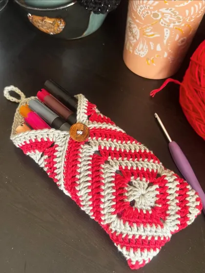 This pouch is perfect for holding pens and markers, keeping your desk or bag tidy and colorful.