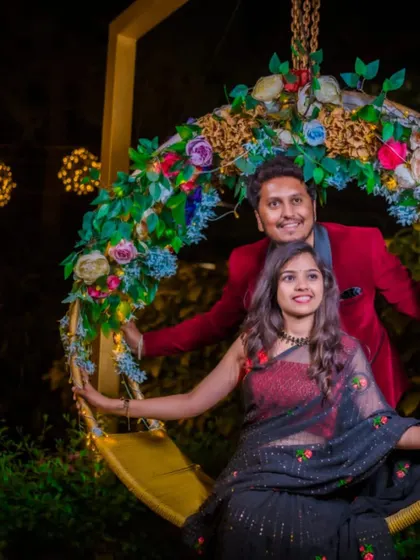 A playful moment from the pre-wedding shoot, showcasing the beautiful drape of the black designer saree.