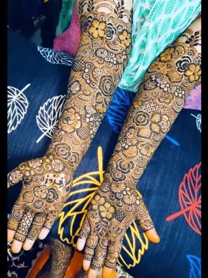 Another angle of this beautiful bridal mehndi, showcasing the intricate patterns on the back of the hands and arms.