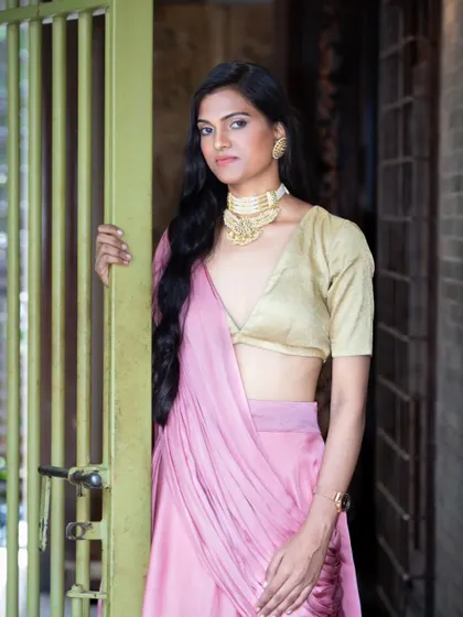 This portrait focuses on the styling of a modern ethnic look, from the statement choker necklace to the metallic blouse. I compose these shots to give equal importance to the garment, accessories, and the model's expression.