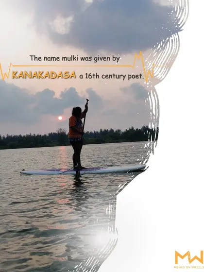 A stand-up paddler silhouetted against the sunset in Mulki. This graphic shares a historical fact about the town's name.