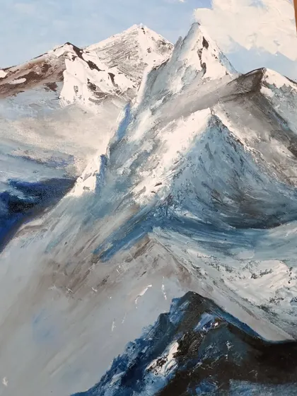 A finished painting of snow-covered mountains, showcasing the use of a palette knife to create sharp, textured peaks.