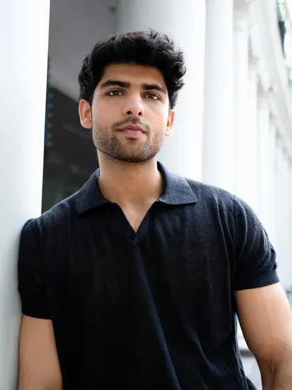 A direct and engaging portrait of a model looking at the camera. This kind of shot is crucial for a portfolio, showing confidence and connecting with the viewer.