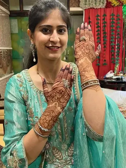 A client showing the beautiful design on the back of her hands.