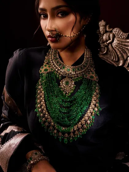 For this portrait, the goal was to create a regal and powerful mood. The dramatic, low-key lighting makes the stunning green beaded necklace the undeniable hero of the image.
