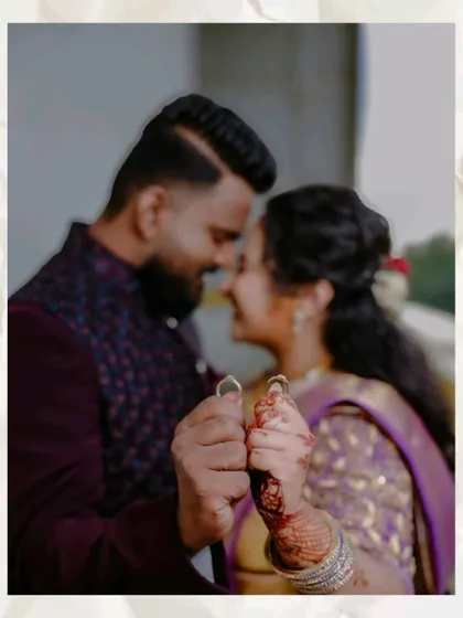 A close-up, slightly blurred shot of a couple holding their engagement rings. The focus on their happy expressions and the rings creates a dreamy and romantic feel.