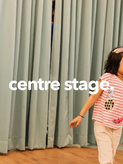 Pooja shines on stage, turning stage fright into a starlight performance. We build confidence by giving every child their moment in the spotlight.