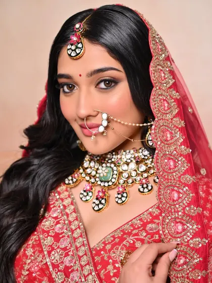 A close-up of a traditional Rajasthani-style bridal look with a beautiful nath and bold eye makeup.