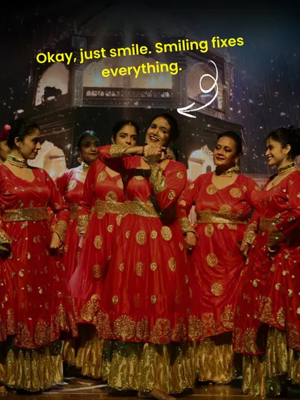 "Okay, just smile. Smiling fixes everything." A funny and true moment captured on stage. When in doubt, a confident smile can make all the difference.
