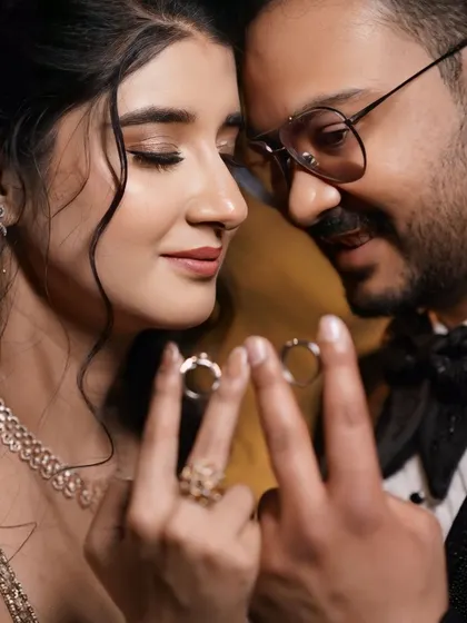 A romantic close-up of the couple. This shot highlights her beautiful eye makeup and soft features.