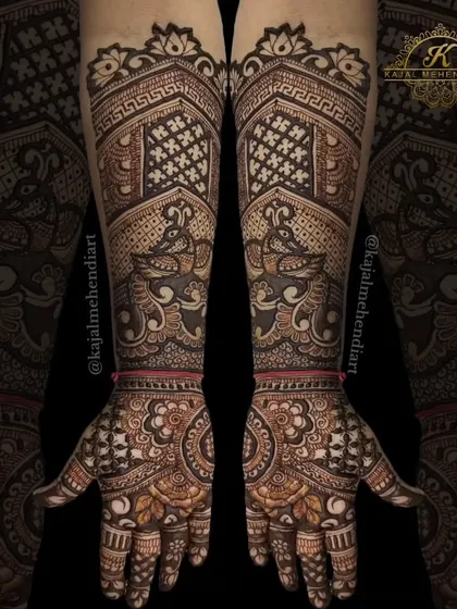 A beautiful symmetrical design for the groom's sister. This style combines geometric patterns with peacock figures, creating a balanced and elegant look that is perfect for wedding celebrations.