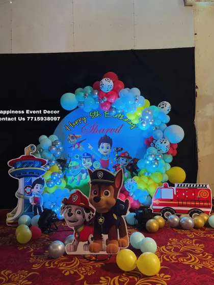 A closer look at the Paw Patrol birthday decor, highlighting the character cutouts and the vibrant balloon colors that bring the theme to life.