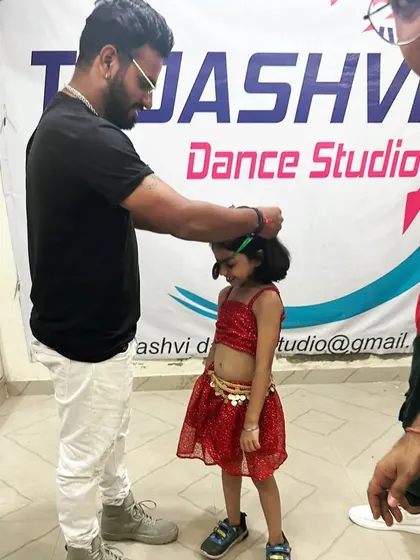 Little Vidhi receiving her medal. She was a star on stage!
