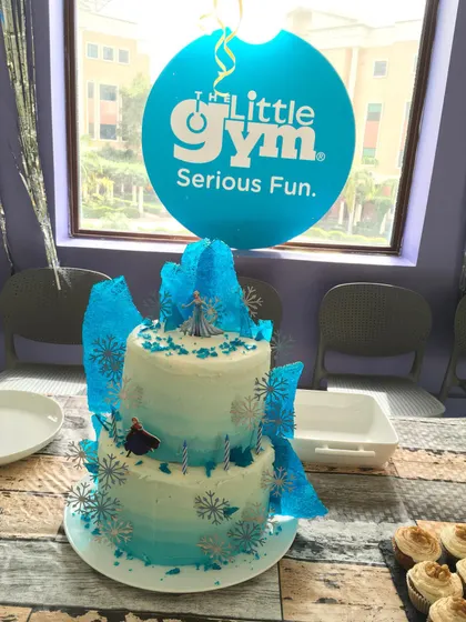 An amazing two-tiered "Frozen" themed cake for Elisa's party. Our party area is ready for whatever amazing cake design you bring.