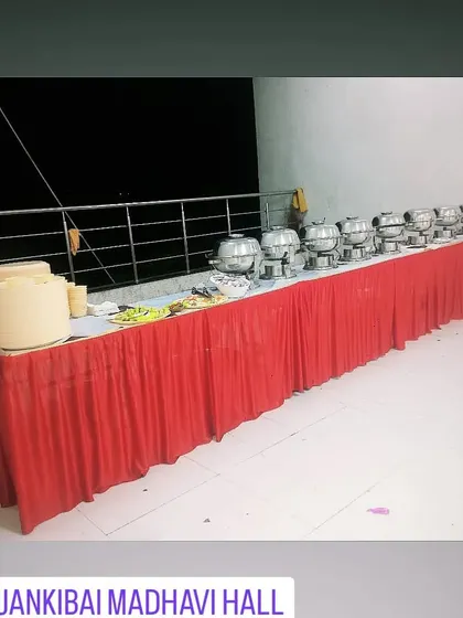 A clean and simple buffet line ready for service at Jankibai Madhavi Hall. This is a practical setup for hall-based events.
