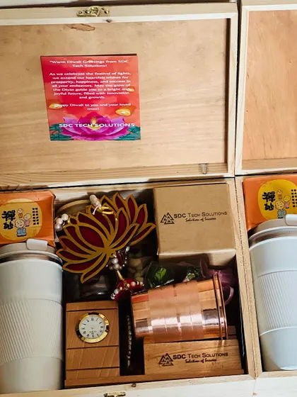 Two 'SDC Tech Solutions' corporate Diwali hampers side by side, displaying the consistent quality and contents of a bulk order.
