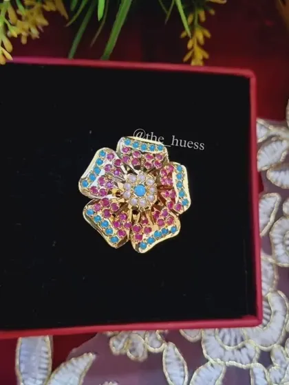 A top-down view of the "Anokhi" ring, highlighting the floral design and the central stone. This is a popular choice for those looking for a bold cocktail ring.
