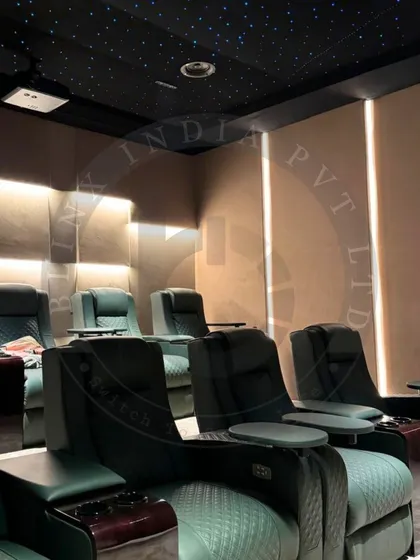 This angle showcases the tiered layout and ambient lighting design of our Amritsar project. The combination of backlit wall panels and a fiber optic star ceiling creates a layered, visually rich environment that complements the high end audio visual experience.