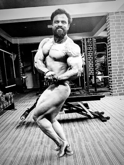 Be addicted to your passions, not your distractions. A black and white shot of my side chest pose, emphasizing the muscle definition and classic lines.