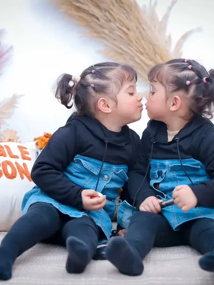 A duplicate of the adorable Eskimo kiss photo, a moment worth seeing twice.
