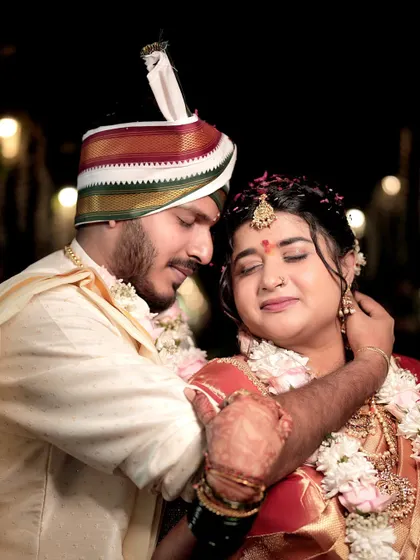 A heartfelt moment during the wedding ceremony, with the groom embracing his bride. This image captures the deep emotion and tradition of the moment, with a focus on their expressions.