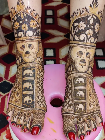 This foot design features panels of elephants, a popular and auspicious motif for bridal henna.