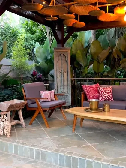 The interior of a custom gazebo, showing how I curate outdoor furniture, lighting, and decor to create a comfortable and stylish lounge space that feels like an extension of the home.