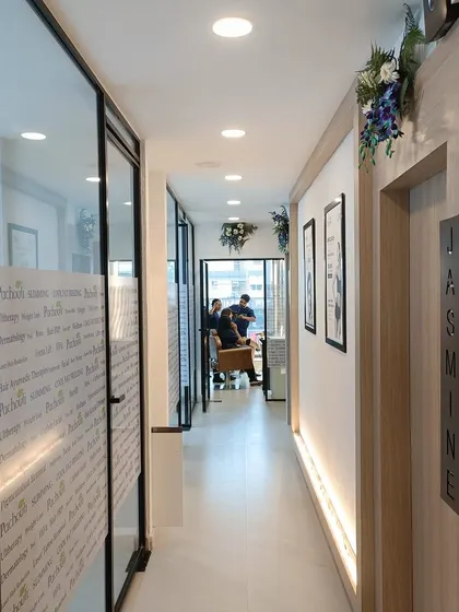 A look down the hallway of our new, serene Vasundhara clinic. Each room is designed to provide a calm and professional environment for your wellness journey.