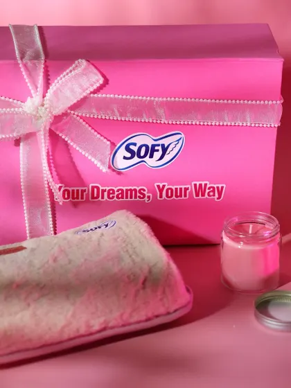 A close-up of the Sofy gift box, highlighting the branded details on the box and the plush, furry pouch included in the hamper.