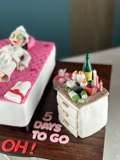 Fabulous, fierce, and finally forty. This cake celebrates the big 4-0 in the most relaxing way possible, with a spa day theme complete with a fondant figure, cucumber eyes, and champagne.