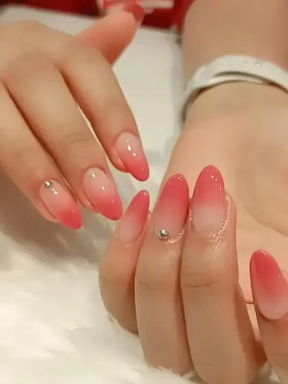 A vibrant pink-to-red ombre set with a single delicate rhinestone accent, perfect for a pop of color.