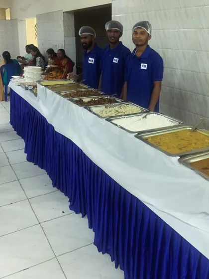 A wide angle of the buffet station, showing the full spread and our team ready to serve.